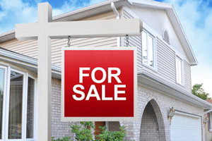 For Sale Sign on Home For Sale Sign on Home